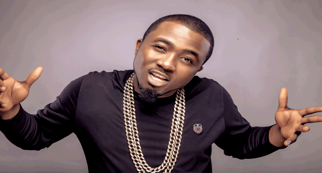 Nigerian DJ portrait with chains